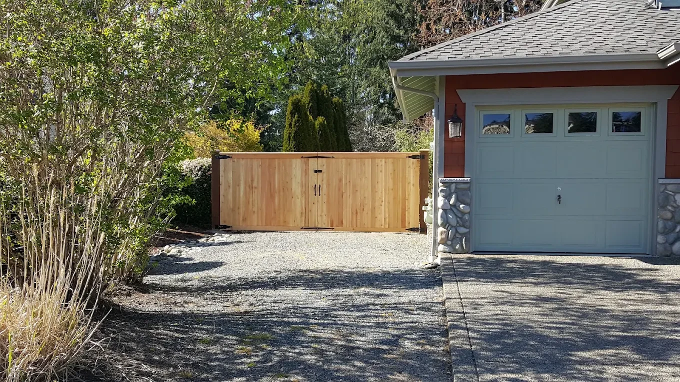 Residential driveway wooden gate garage